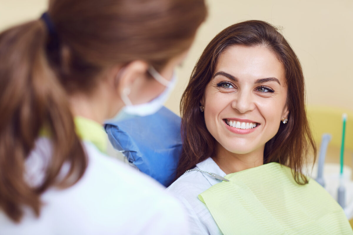 Smiling patient with a dentist at a Fort Myers dental office