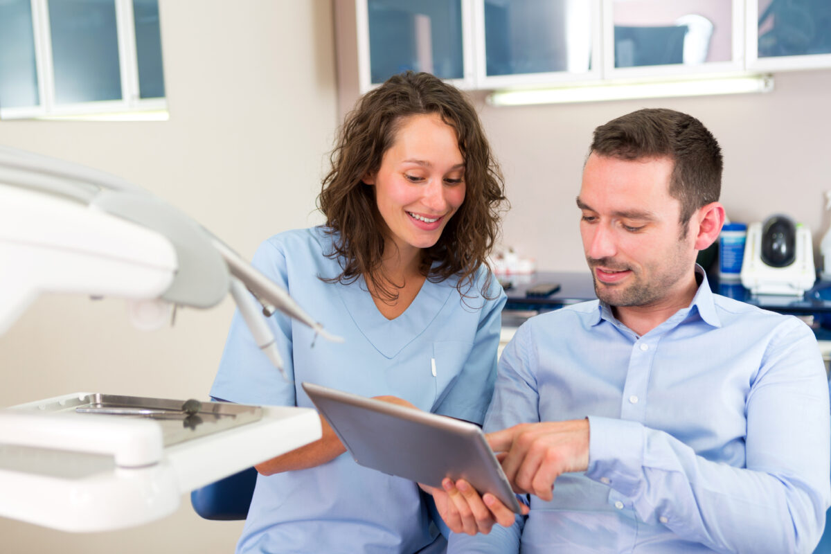 Dentist explaining a treatment plan to a patient